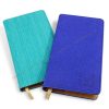 Pocket notepad with different material covers