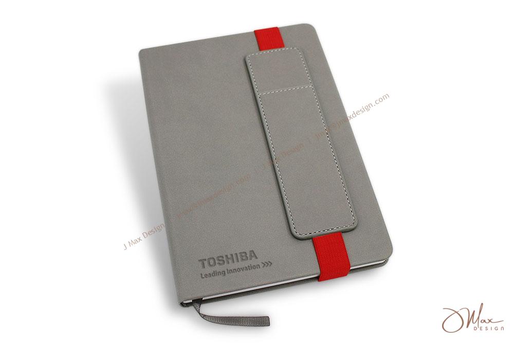 Hardcover notepad with removable pen pouch Logo embossed on hardcover notepad with a removable pen pouch
