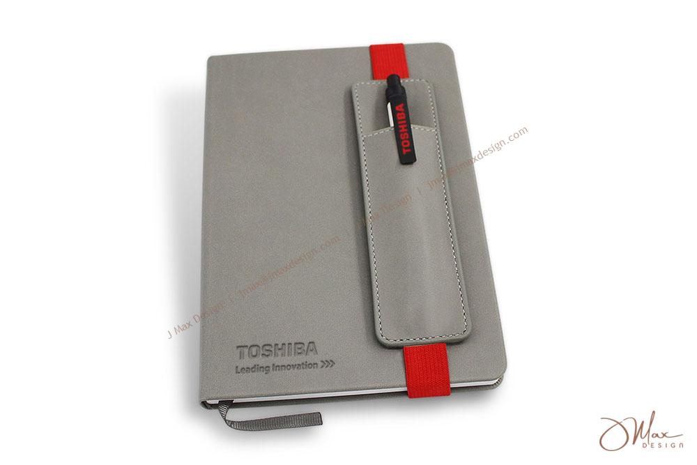 Hardcover notepad with a removable pen pouch