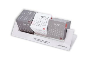 Rotating calendar cubes set with custom imprint