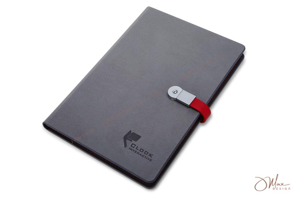 USB flash drive notepad in grey featuring a red closure USB flash drive notepad with embossed logo