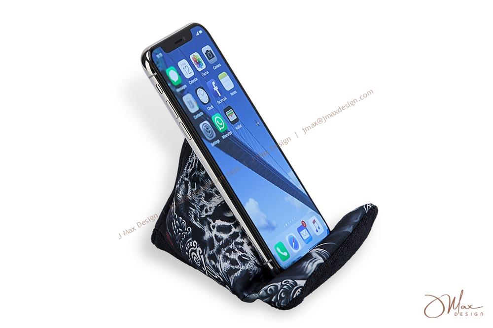 iPhone placed firmly on cell phone pillow iPhone sits on a beaded pillow