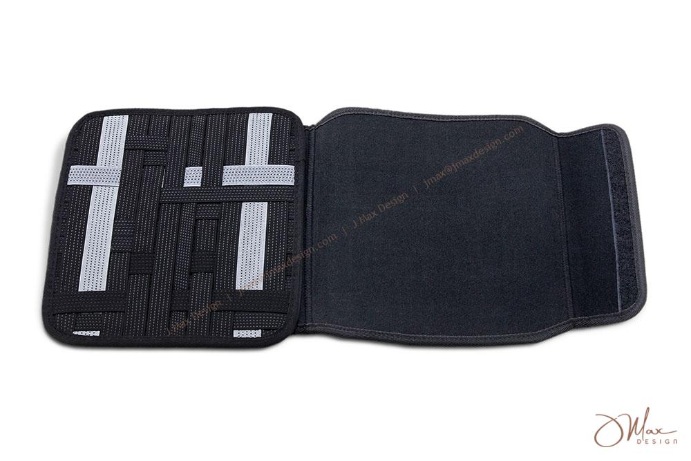 Elastic grid organizer with grey and black non-slip bands An unfolded Elastic grid organizer