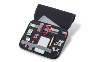 Small items are securely held by an elastic-grid organizer