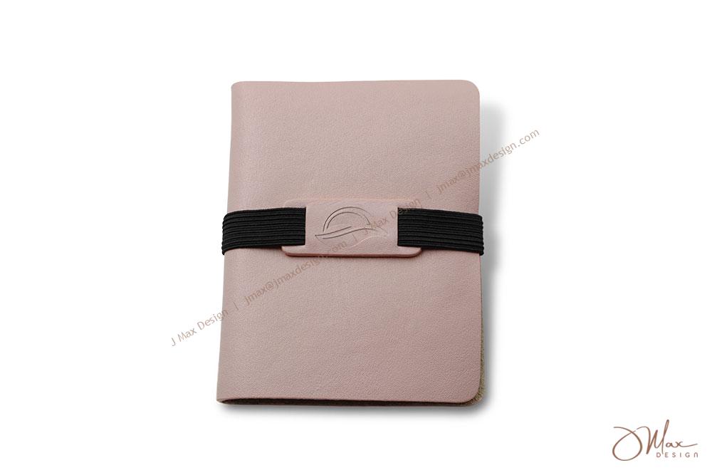 Card holder with embossed logo on elastic band closure
