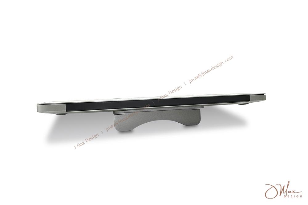 Metal laptop stand on table A laptop with a Metal laptop stand on a flat surface