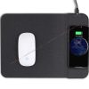 cell phone is charging on a flat mouse pad