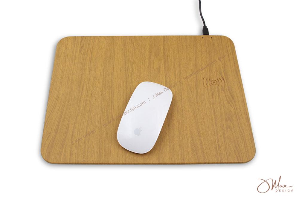 Magic mouse on a wooden-patterned mousepad