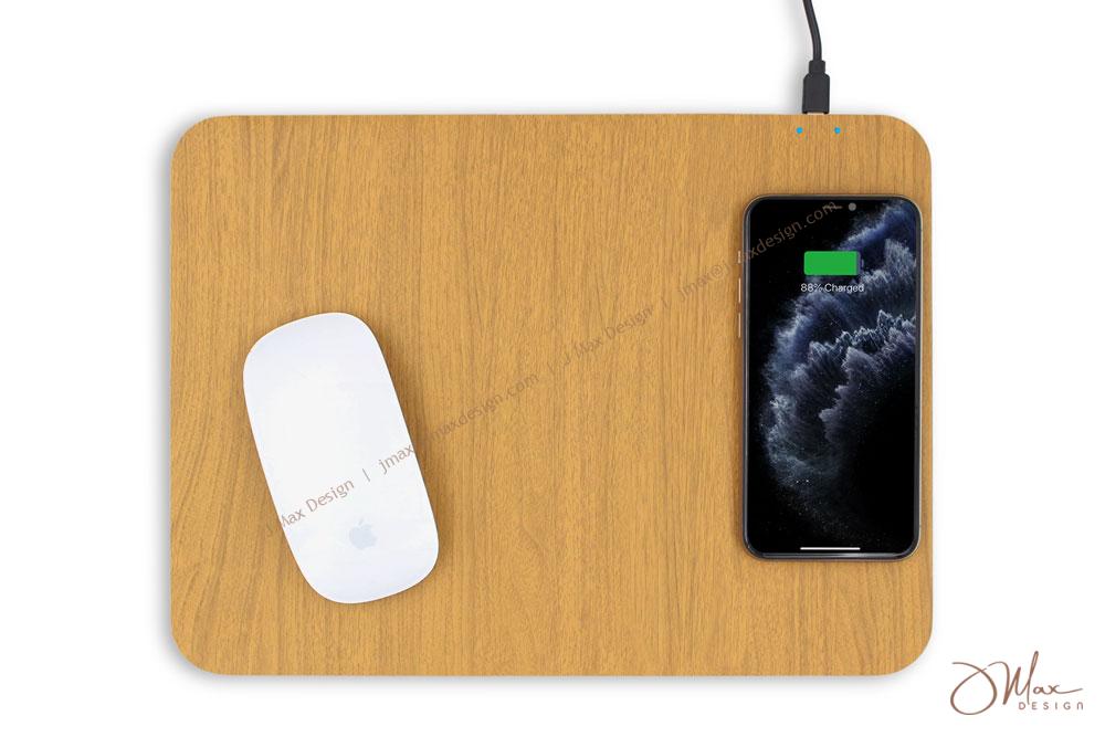 Wireless mouse and cell phone on wooden-patterned mousepad