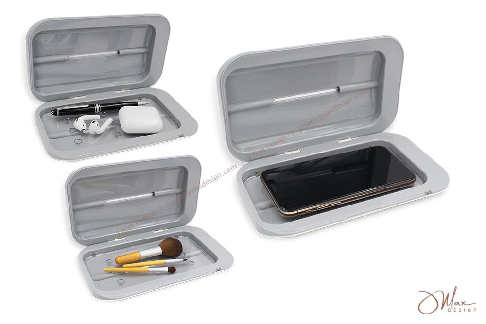 Three UV-C Sanitizer Boxes UV-C Sanitizer Box with items in the inner compartments