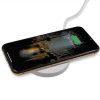 Cell phone is being charging on round wheat straw wireless charger