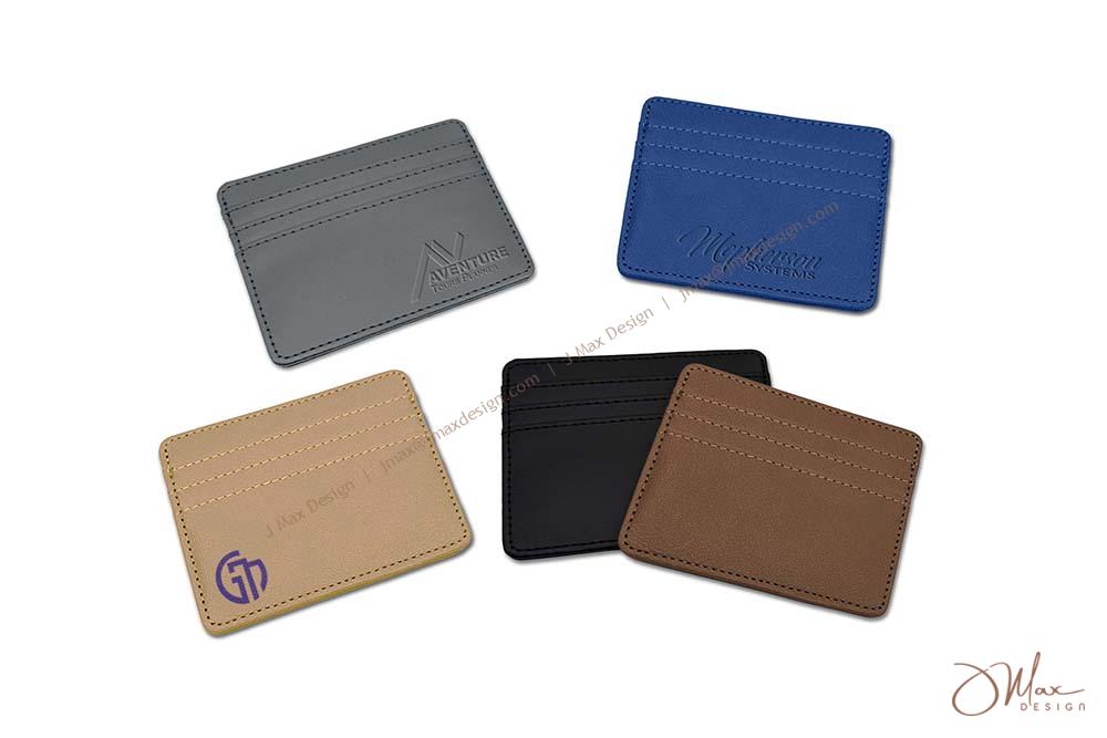 Five customizable RFID blocking card cases in various colors (gray, blue, black, tan, and brown) with different logo designs.